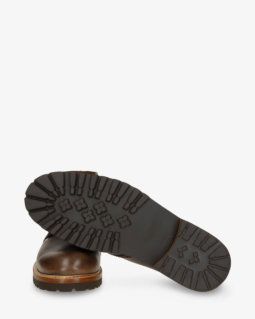 Erick botín de piel con forro interior de piel. cuero