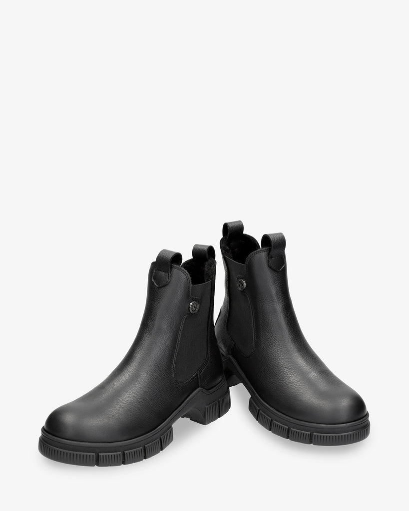 Nery Igloo botines de piel con forro interior de pelo natural. negro