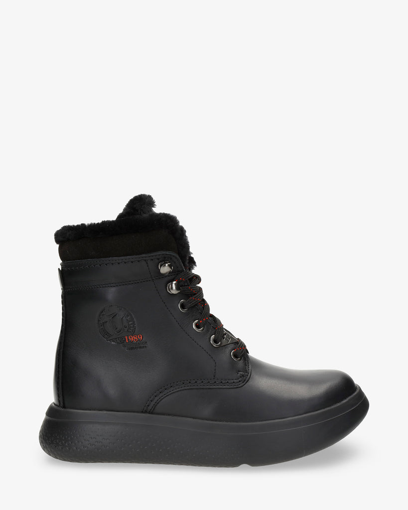 Yara Igloo botas de piel con forro interior de pelo natural. negro